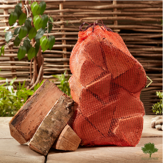 Netted bag of Logs, 10 Logs in a bag with 3 to the side, Hardwood, Plant in Background, Fence in Back